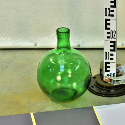 Large green spherical glass bottle in an Unicum liqueur form Large green spherical glass bottle in an Unicum liqueur form