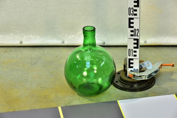 Large green spherical glass bottle in an Unicum liqueur form
