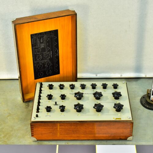 Unidentified 1970s electrical instrument in a wooden case Unidentified 1970s electrical instrument in a wooden case