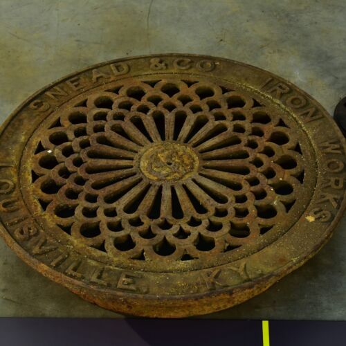 Ornate Louisville cast-iron manhole cover without installation frame
