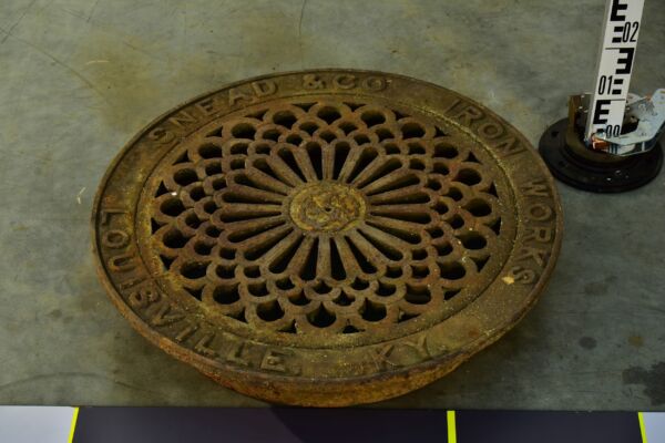 Ornate Louisville cast-iron manhole cover without installation frame Ornate Louisville cast-iron manhole cover without installation frame