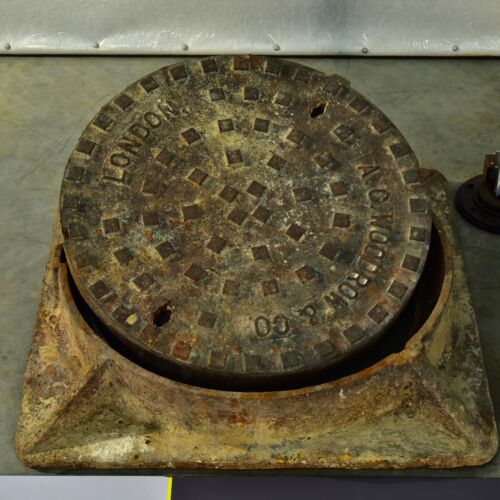 London cast-iron manhole cover with installation frame