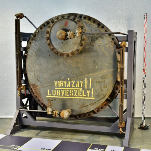 1950s thermal power station alkali tank with sight-glass level indicators, on steel support frame