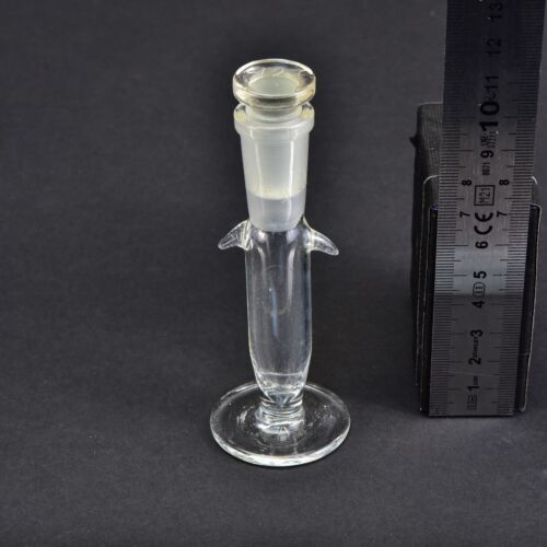 Footed laboratory glass vessel with ground-glass stopper and fixing lugs Footed laboratory glass vessel with ground-glass stopper and fixing lugs