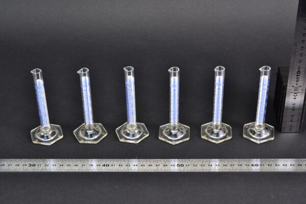 Miniature 5 ml glass graduated cylinders with blue graduations and hexagonal bases – set of 6 Miniature 5 ml glass graduated cylinders with blue graduations and hexagonal bases – set of 6