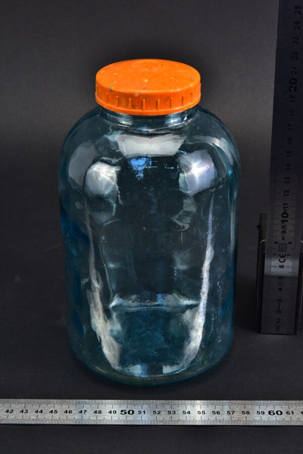 Blue powder jar with orange screw cap Blue powder jar with orange screw cap