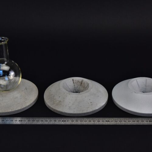 Set of three cast aluminium flask supports with small openings and wide bases Set of three cast aluminium flask supports with small openings and wide bases