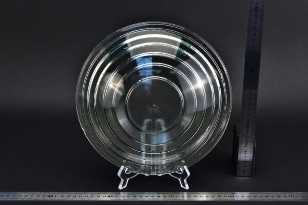 Large clear glass Fresnel lens recovered from a ruined glass factory