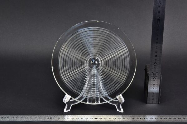 Clear glass Fresnel lens recovered from a ruined glass factory