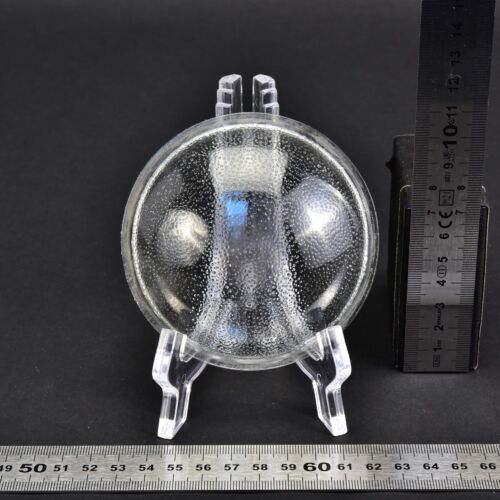Domed glass lens with a stippled pattern Domed glass lens with a stippled pattern