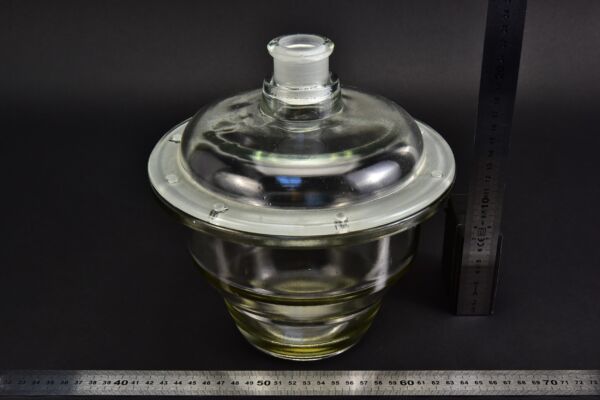 Glass desiccator with a drilled lid, recovered from a ruined glass factory Glass desiccator with a drilled lid, recovered from a ruined glass factory