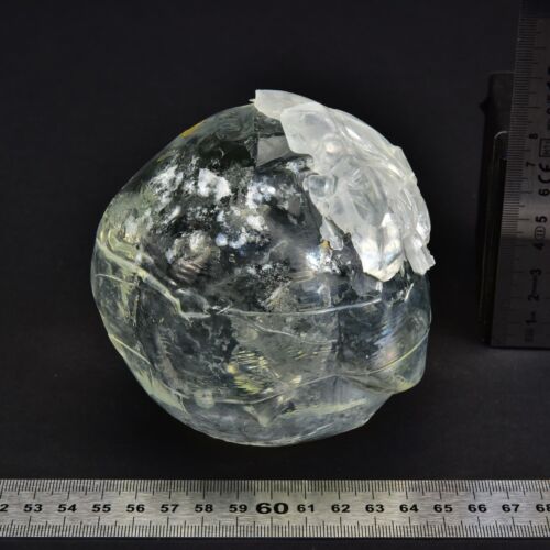 Cracked cocoon-shaped solid glass block