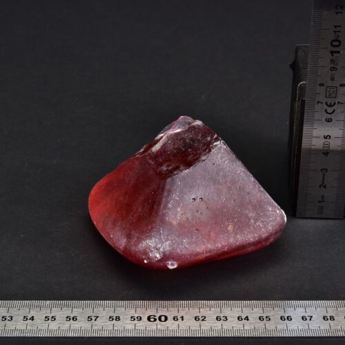 Solid red glass pyramid with a broken tip Solid red glass pyramid with a broken tip