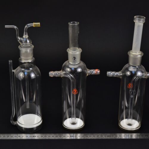 Set of three assorted laboratory gas-washing bottles with sintered-glass discs Set of three assorted laboratory gas-washing bottles with sintered-glass discs