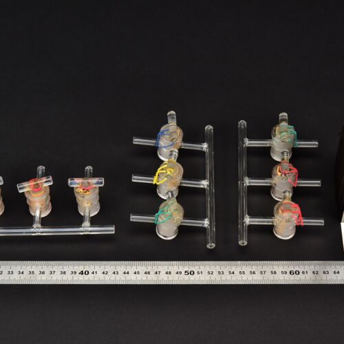 Set of three three-port laboratory glass manifolds with glass stopcocks Set of three three-port laboratory glass manifolds with glass stopcocks