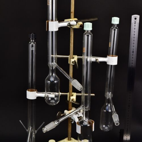 Set of four screw-capped laboratory glassware units with side connections