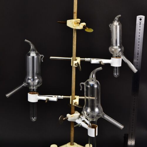 Set of three laboratory glassware units with internal tube inserts and angled side arms