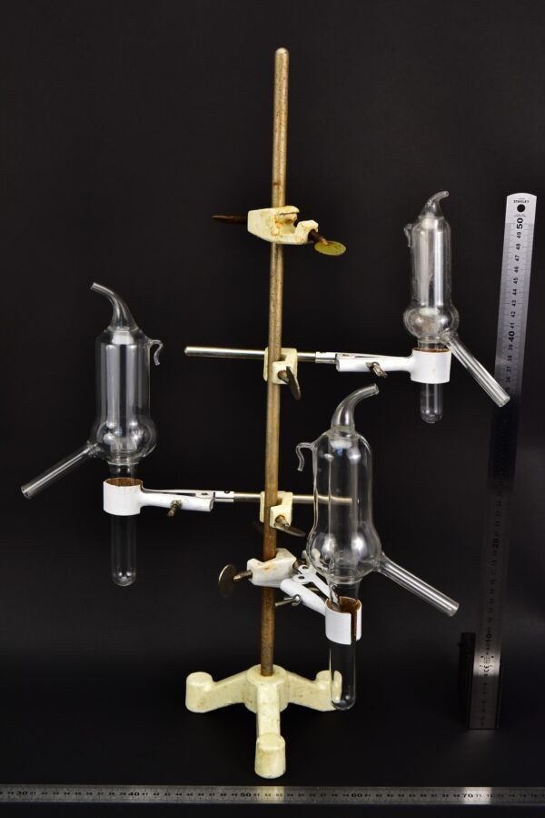 Set of three laboratory glassware units with internal tube inserts and angled side arms