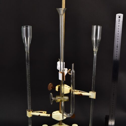 Set of three assorted laboratory glass measuring instruments with a stopcock-equipped U-tube Set of three assorted laboratory glass measuring instruments with a stopcock-equipped U-tube