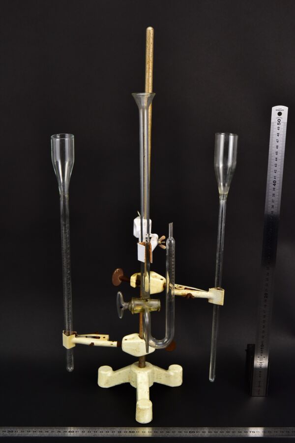 Set of three assorted laboratory glass measuring instruments with a stopcock-equipped U-tube
