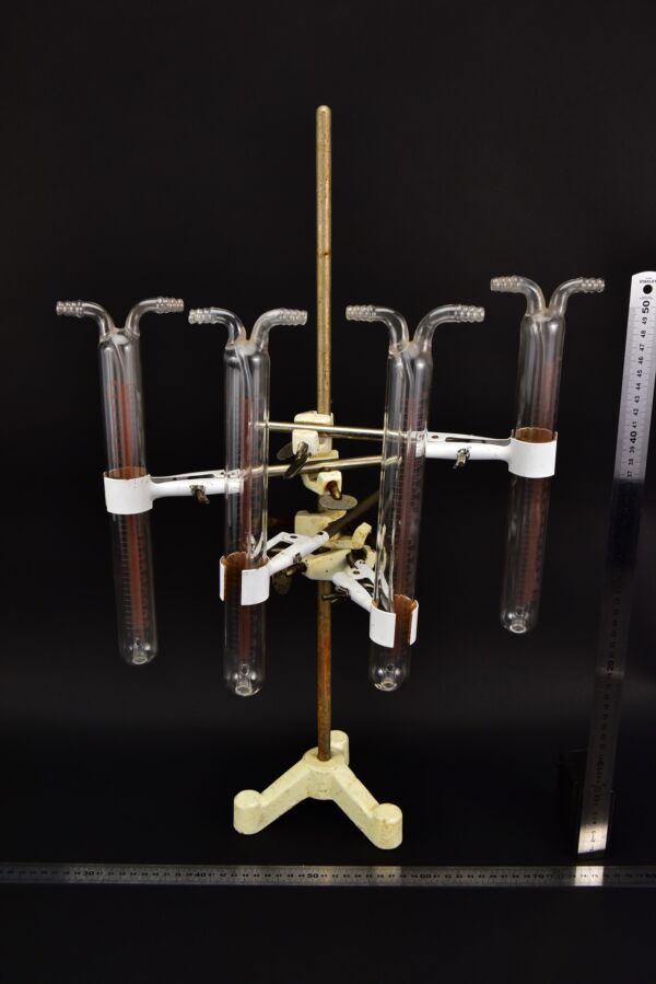 Set of four graduated laboratory glass measuring tubes with twin upper connections