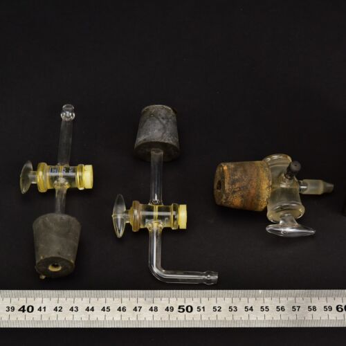 Set of three laboratory glass stopcocks with bungs